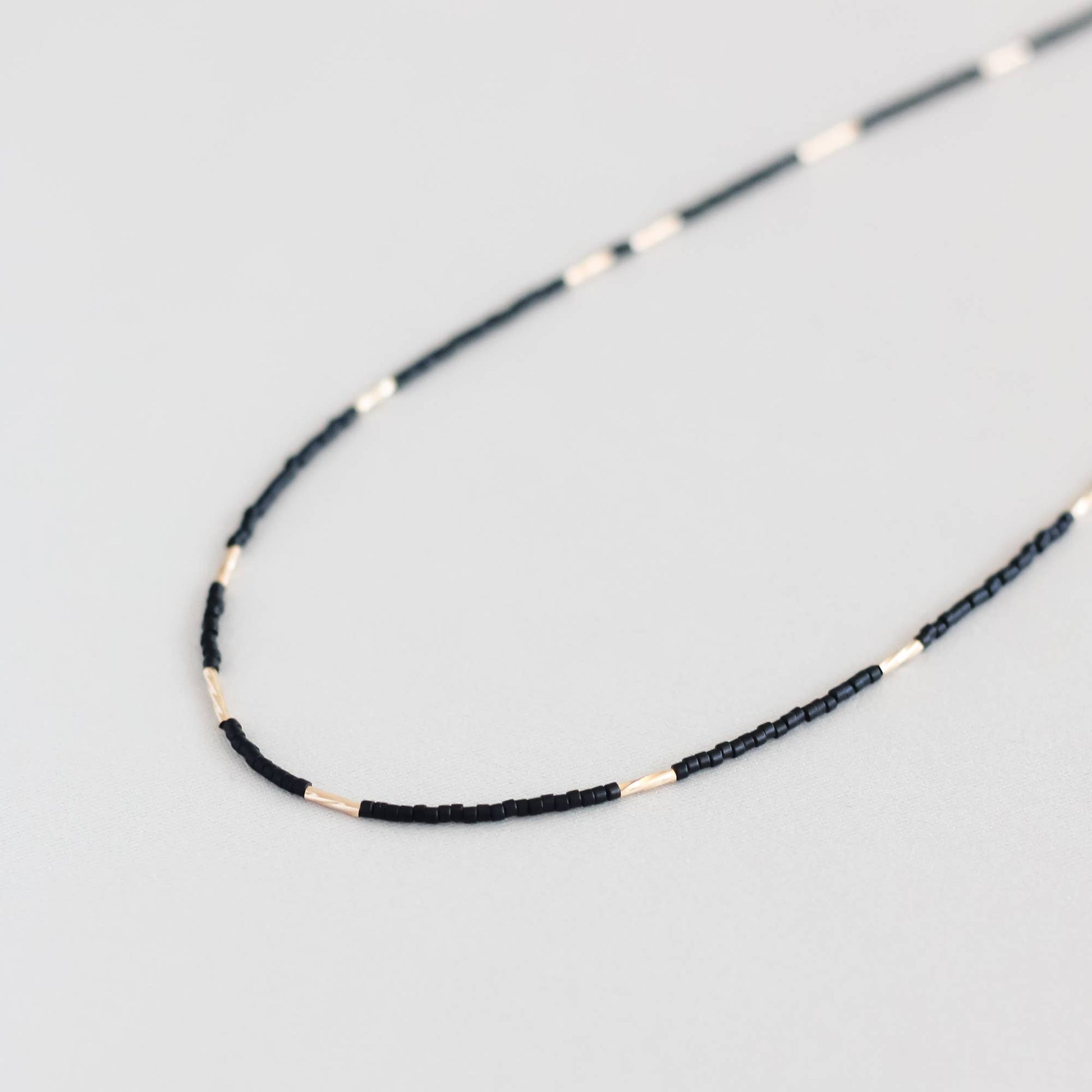 Flow Necklace – Black + Gold